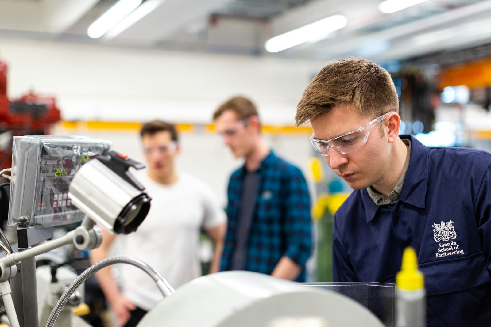 Engineering team workspace with hardware and test equipment